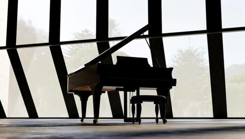 A grand piano stands in an empty, sunlit room with expansive, angular windows. The sleek silhouette