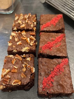 Freshly baked brownies with pacan nuts and raspberries, Vienna, Austria