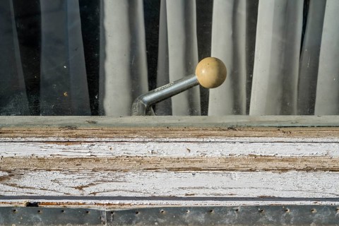 Old building, casement window with a rotary handle