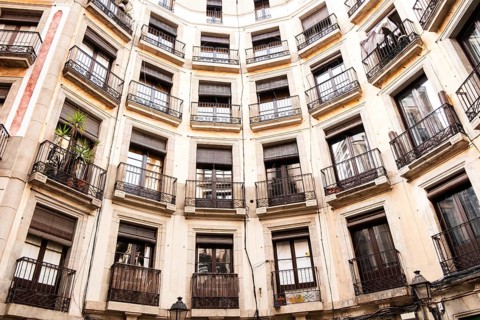 A house built in a semicircle on a square in the historic centre of Barcelona, Spain