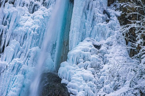 Urach waterfall full of bizarre ice formations frozen at winter temperatures, Bad Urach, Swabian