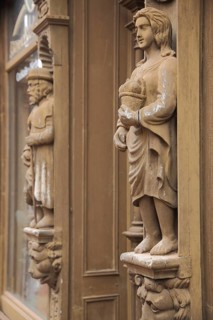 Wooden figure at Krummel's house, wood carvings, statue, standing female figure with basket