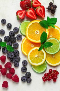 Mix of fruits and berries, set, assortment, sliced citrus fruits, raspberries, blueberries, mint