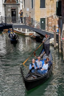 Gondola with tourists on a canal, San Marco district, Venice, Veneto region, Italy