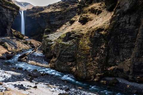 Waterfall with stream in lava rock gorge, winter, snow, Kvernufoss, Skogar, Iceland, Scandinavia