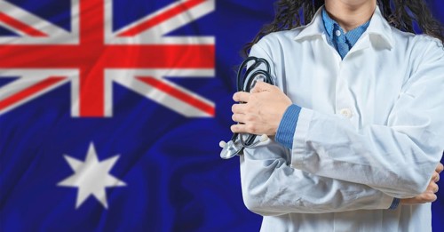 Healthcare professional with Australia flag background. Professional doctor holding stethoscope on