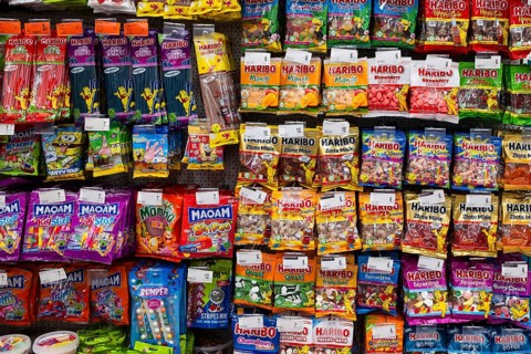 LUBIN, POLAND - JANUARY 15, 2026: Shelves in a supermarket filled with various colorful Haribo and