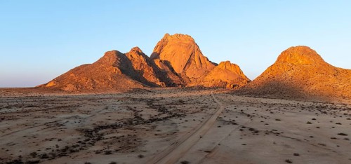 Aerial view, sunset, mountains in the desert, Spitzkoppe summit, Namib desert, Namibia