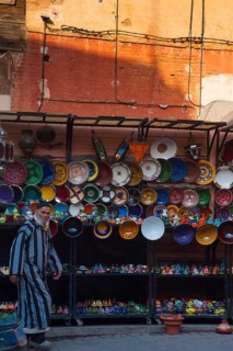 Merchant in the medina, man, ceramics, plate, shop, souvenir, shopping, travel, holiday, city trip,