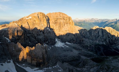 Impressive mountain peaks of the Brenta Mountains, sunrise, 360 degree alpine panorama, aerial