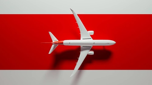 A striking commercial airplane flies over a bold red surface, symbolizing travel and adventure.