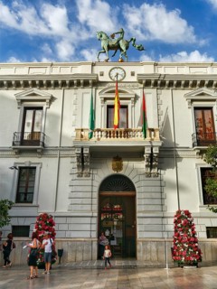 Pedestrian in front of the town hall, Granada, Andalusia, Spain