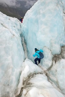 Mountaineer on glacier, Fox Glacier, Westland National Park, South Island, New Zealand