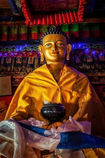 Buddha Sakyamuni statue in Spituk Gompa (Tibetan Buddhist monastery) . Ladakh, India