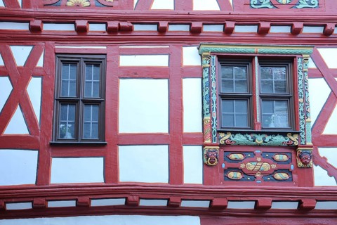 House wall with two windows, wood carving, painting, decorations, historic office, half-timbered