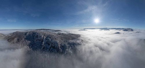 Aerial view of snowy stone walls and fog in the valley, Schwarzensee, Weissenbach an der Triesting,