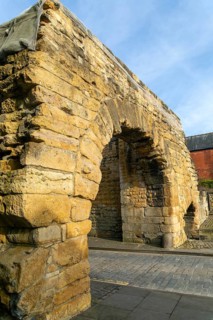 Newport Arch on Ermine Street, Roman entrance gateway to city of Lincoln, Lincolnshire, England, UK