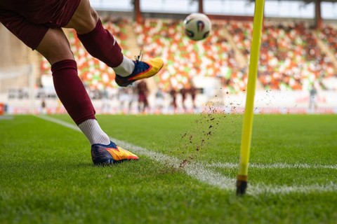 Player kicks the ball from the corner during the soccer match in Lubin, Poland