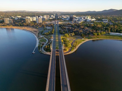 From above drone stunning view of Canberra, Australia's capital, showcasing prominent roads that