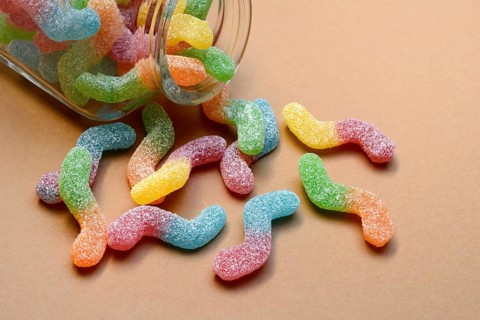 Lots of colorful jelly sweets with glass containers