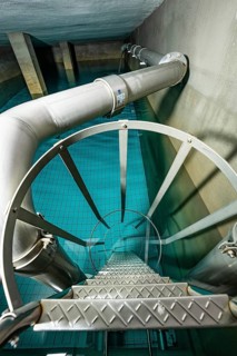 Metal tank with a spiral staircase and blue tiled floor, ENCW Netze Calw waterworks, Calw, Black