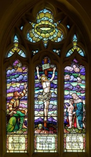 Stained glass window of Crucifixion by TW Camm 1907, Wroughton church, Wiltshire, England, UK
