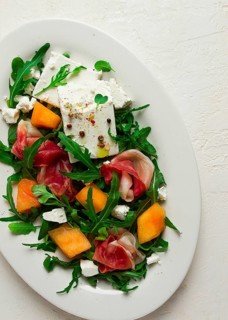 Salad, melon with prosciutto, arugula, and cheese, summer salad, vegetarian, homemade, no people
