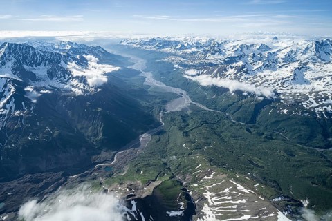 Mountain valley with river, snow and ice, epic mountains with glaciers, aerial view, Alaska Range,