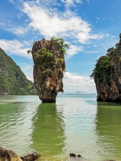 Breathtaking beauty of Phuket, Thailand, where lush limestone cliffs rise dramatically from emerald