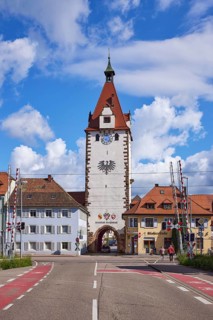 Kinzigtor town gate with gated railway crossing and road in Gengenbach, Black Forest, Ortenaukreis,