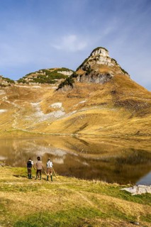 The Austrian alphorn trio Klangholz plays the alphorn at Lake Augstsee on Mount Loser. Mount