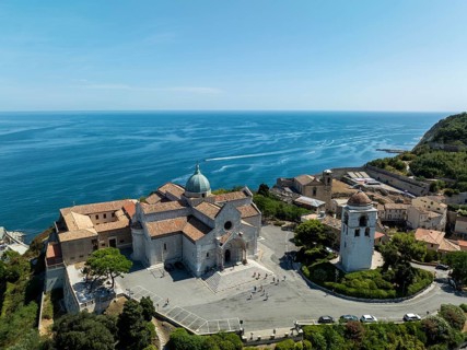 A stunning aerial view of a historic church near Ancona, Italy, overlooking the pristine Adriatic
