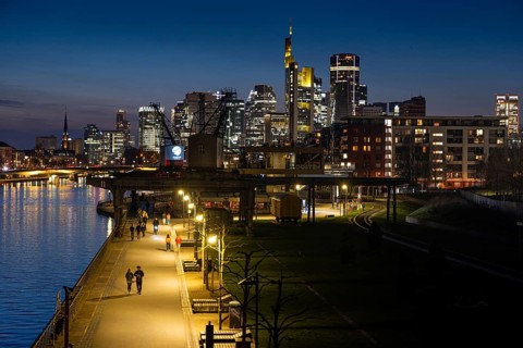 The lights of Frankfurt's banking skyline glow in the evening, Frankfurt am Main, Hesse, Germany