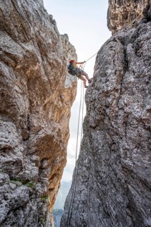 Climber on a climbing tour, abseiling, alpine climbing, crossing the Kampenwand, Chiemgau, Bavaria,