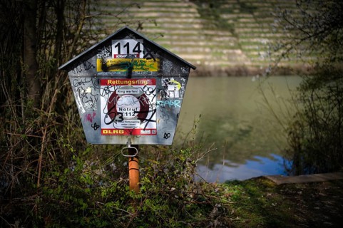 Graffiti, vandalism, lifebuoy, Max-Eyth-See, Hofen, behind Neckar, Stuttgart, Baden-Württemberg,
