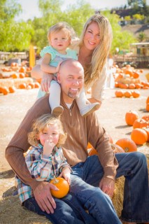 Adorable Young Family Enjoys a Day at the Pumpkin Patch