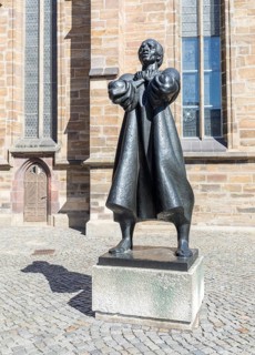 Statue of Thomas Müntzer, created by Jürgen Raue, in front of St Catherine's Church, Zwickau,