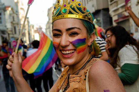 Istanbul, Turkey. 28th June, 2015 A young Turkish woman with rainbow face paint celebrates Gay
