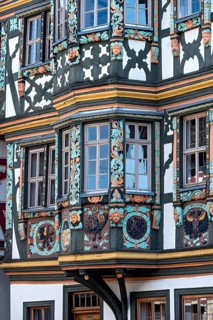 Killingerhaus, magnificent half-timbered house, colourful painted carvings on the bay window,