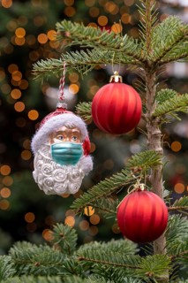 Symbolic image of Christmas in the Corona crisis, Father Christmas figure, Christmas tree