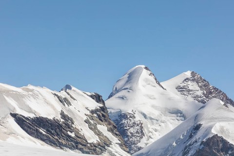 Stunning view of snow-capped mountains in Zermatt, Switzerland, showcasing the majestic alpine
