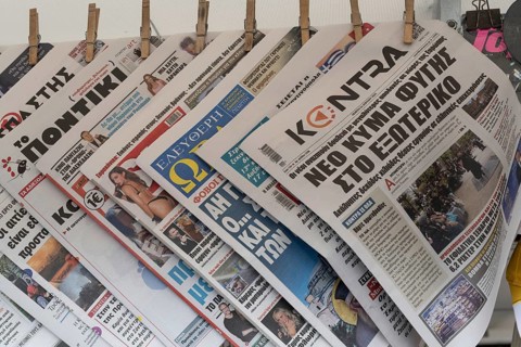Athens, Greece. April 24th 2025. A selection of printed Greek newspapers for sale outside an Athens