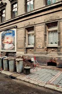 Historical photo construction site with advertising poster of a video store, probably in Halle