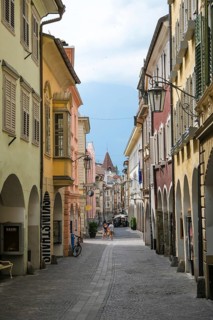 Merano, South Tyrol, Italy, A few passers-by stroll through the Laubengasse, the arcades are the