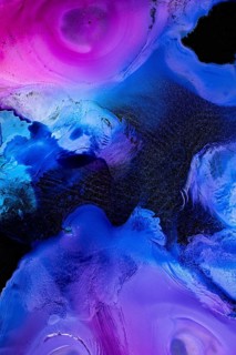 A mesmerizing abstract liquids art piece featuring vibrant pink and blue swirling patterns with