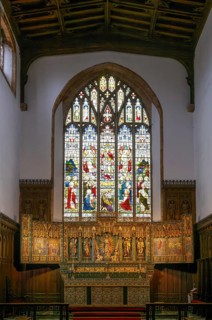 Stained glass east window, elaborately carved gilt altar reredos screen 1938, church of Saint John
