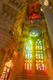 Sunlight streaming through vibrant stained glass windows, creating a mesmerizing display of color