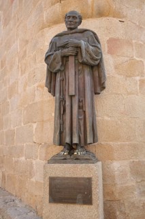 Monument to priest San Pedro de Alcantara 1499-1562, saint with cross, bronze sculpture, Plaza de