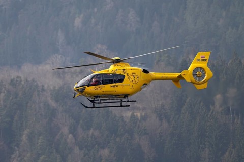 Rescue helicopter, emergency helicopter in flight, Schwaz, Tyrol, Austria