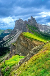 Majestic peaks rise above a vibrant green landscape, showcasing the beauty of the italian dolomites
